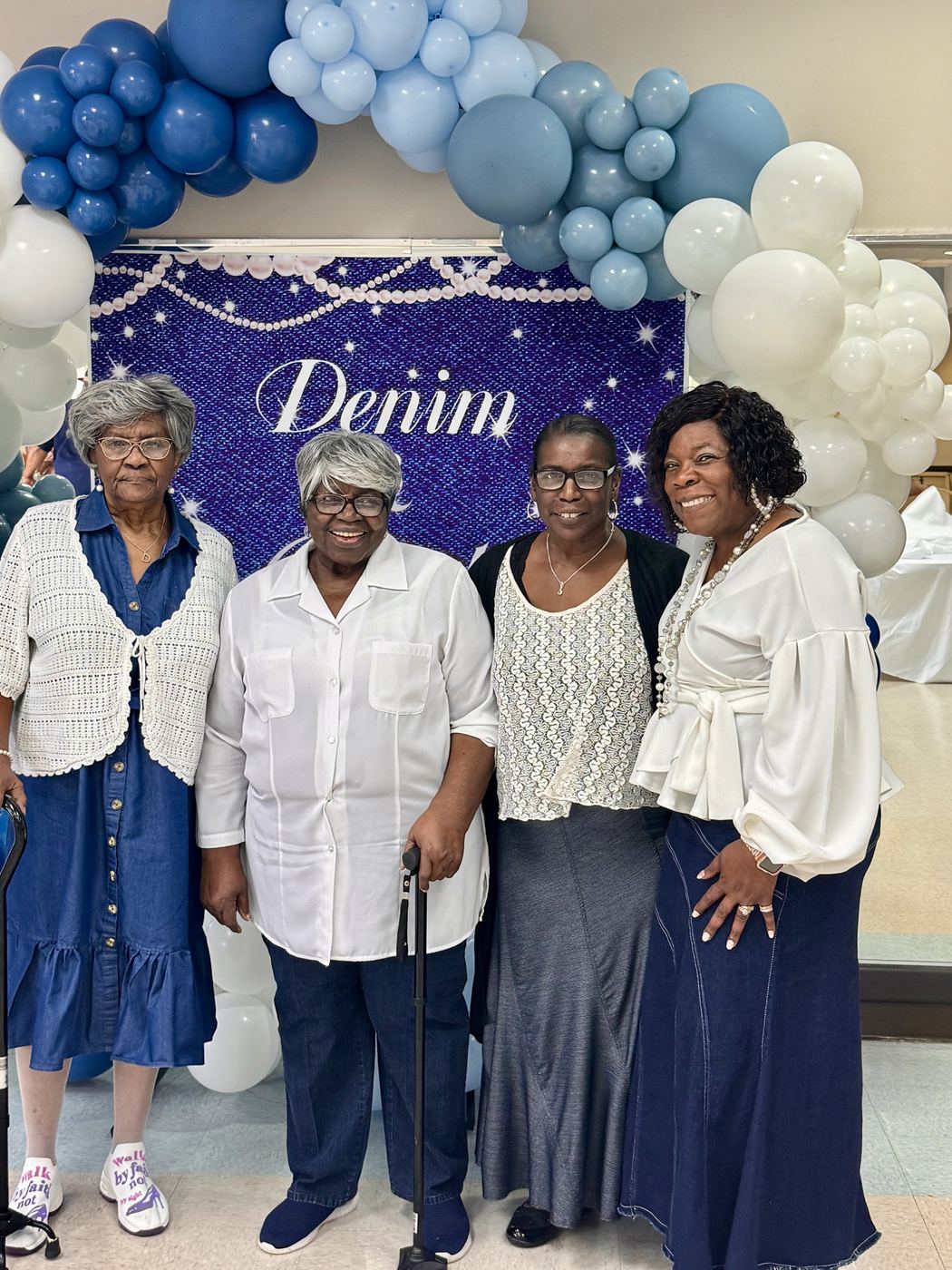 Cynthia Johnson with community members at a denim-themed community event